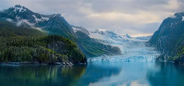 Coastal Alaska wilderness | Alaska Coastal Hunts Panoramic Alaskan coastal fjord with glaciers, evergreen forests and steep mountains